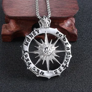 Macro detail of sunburst pendant with engraved Get Money and Pure Success text