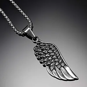Vintage stainless steel wing pendant necklace with detailed silver feather carvings
