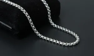 Detailed macro view of high-polished stainless steel box chain for men jewelry