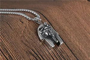Detail of vintage silver Egyptian Pharaoh Tutankhamun pendant on square box chain