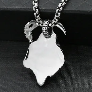 Macro detail of silver stainless steel grim reaper scythe pendant on a thick box chain