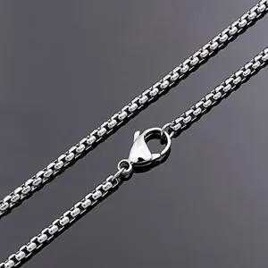 Detailed close-up of a silver stainless steel square box chain with a lobster clasp