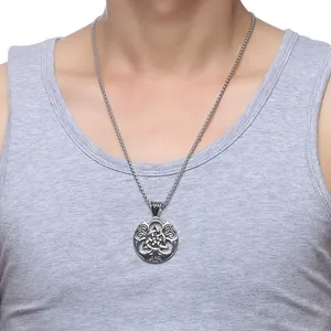 Macro shot of a vintage Celtic knot round pendant necklace on a stainless steel chain