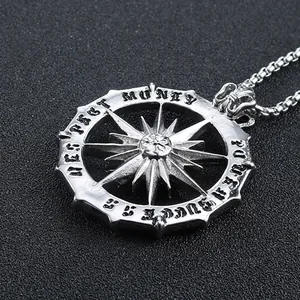 Detail view of silver sun god pendant with Money and Respect gothic engravings