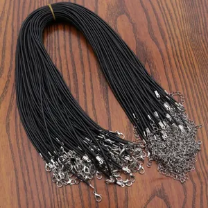 Detail showing bulk black waxed cord necklaces with silver lobster clasps and extenders