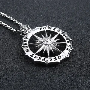 Detail of sun god steel pendant with engraved Power, Success, Respect, Money lettering