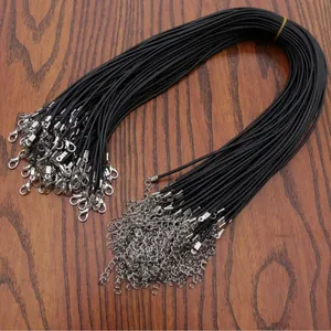 Detail of black waxed cord necklace strands with silver lobster clasps and extension chains