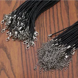 Detail of bulk black wax cord necklaces with silver lobster clasps and extension chains