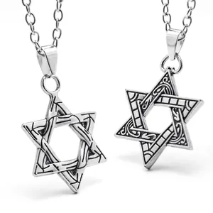 Detailed macro view of two hexagram pendants with geometric patterns on silver O-chains
