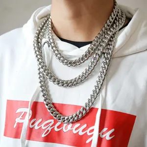 Three-piece layered silver Cuban link necklaces for men in various lengths shown on a hoodie