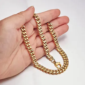 Classic golden Cuban link chain necklace with lobster clasp closure in stainless steel