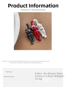Detailed view of three cat brooches with dimensions 4.5cm by 3.9cm and 15.4g weight