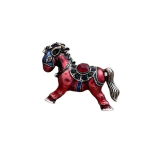 Vintage horse brooch with red blue enamel and crystal inlay on silver metal