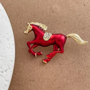 Vintage red galloping horse brooch with gold trim and rhinestones for suits