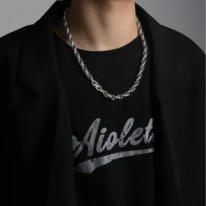 Hip-hop style stainless steel rope chain necklace on male model wearing black suit