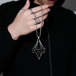Detailed close-up of retro silver Eye of Horus pendant with wings on a steel chain