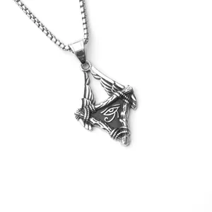 Macro shot of stainless steel Eye of Horus pendant with textured wings and box chain