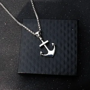 Skull anchor pendant necklace with box chain on elegant black textured jewelry box