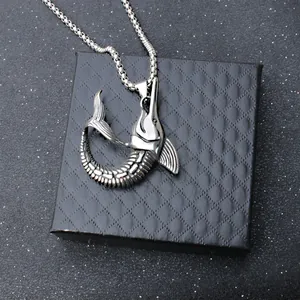 Vintage stainless steel marlin fish pendant necklace on black jewelry box display