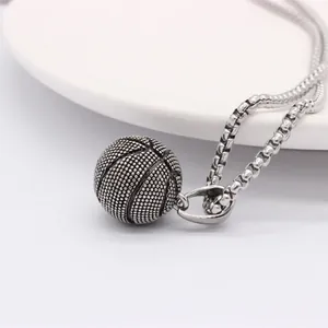 Vintage basketball pendant necklace with textured detail on stainless steel box chain
