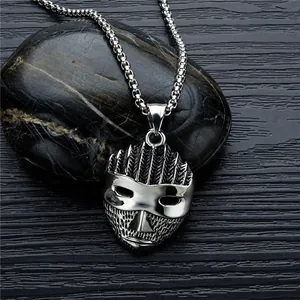 Retro punk warrior mask pendant in silver stainless steel on dark stone background