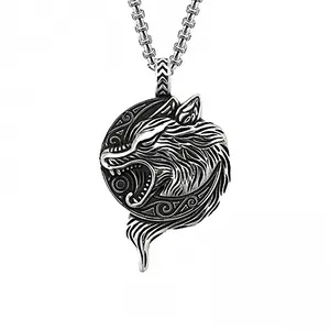 Close-up of vintage wolf head pendant in silver finish with detailed box chain