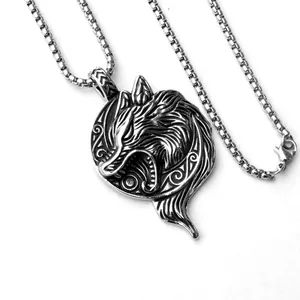 Detail of Viking wolf head pendant with Celtic knotwork on a silver steel box chain