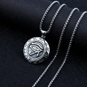 Macro detail of Eye of Horus pendant with ancient Egyptian symbols on box chain