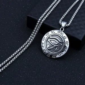 Detailed macro view of Eye of Horus engraving on stainless steel pendant with box chain