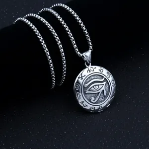 Macro shot of stainless steel Eye of Horus pendant with ancient Egyptian hieroglyphs