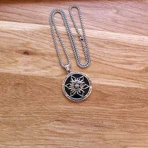 Men's retro stainless steel round star pendant necklace with silver box chain on wood