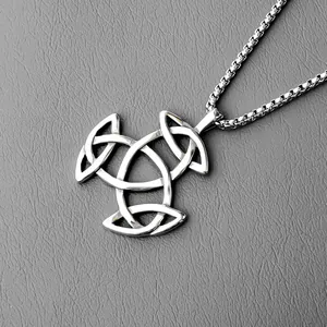 Macro view of silver Celtic Trinity Knot pendant on a box chain with polished finish