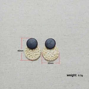 Detailed size display of retro round woven rattan earrings with black resin disk