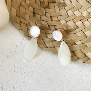 Rattan woven drop earrings with white resin beads and leaf-shaped pendants for summer
