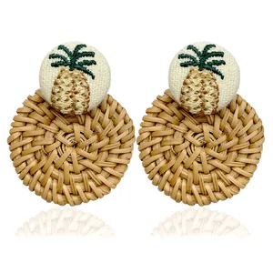 Bohemian rattan hoop earrings with pineapple embroidery and white fabric stud details