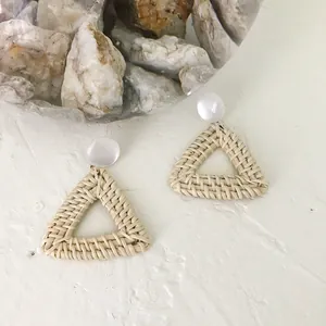 Geometric triangular rattan drop earrings with white beads and bohemian woven design