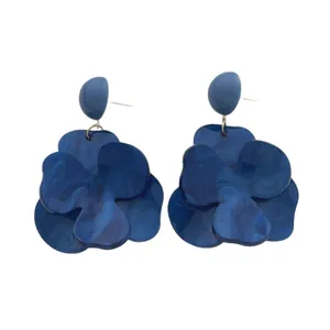 French vintage style large deep blue flower earrings with marble pattern on white backdrop