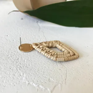 Bohemian rattan woven diamond drop earrings with golden stud and natural straw details
