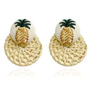 Handmade woven rattan hoop earrings featuring pineapple fabric embroidery for summer style
