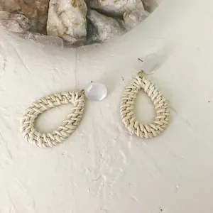 Bohemian rattan drop earrings with cream pearl studs and large straw waterdrop charms