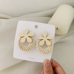 Elegant wood flower earrings with woven straw circle drop in a fresh Korean style