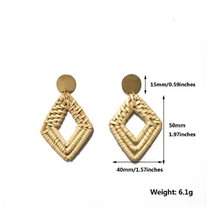 Detail view of handmade rattan diamond drop earrings with golden studs and measurements