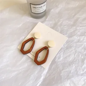Fashionable wood patchwork geometric drop earrings on display card with white stud