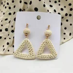 Bohemian woven rattan earrings with geometric triangle pendants and natural wooden beads