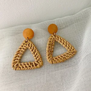 Bohemian handmade rattan earrings with wooden studs and hollow triangle pendants
