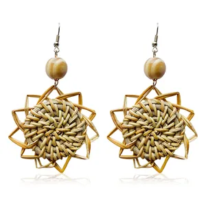 Handmade star-shaped rattan earrings with wooden beads in bohemian ethnic style
