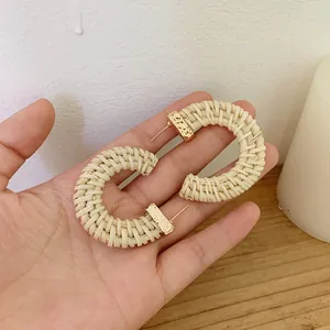 Handmade large C-shape natural rattan hoop earrings with gold metal fasteners