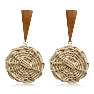 Handmade woven rattan round earrings with dark brown wood triangle studs in boho style