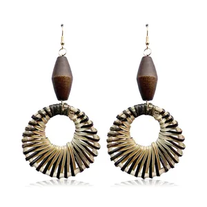 Ethnic handmade woven hollow round earrings with geometric straw fibers in bohemian style