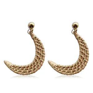 Handmade woven crescent moon rattan earrings with golden stud accents for women